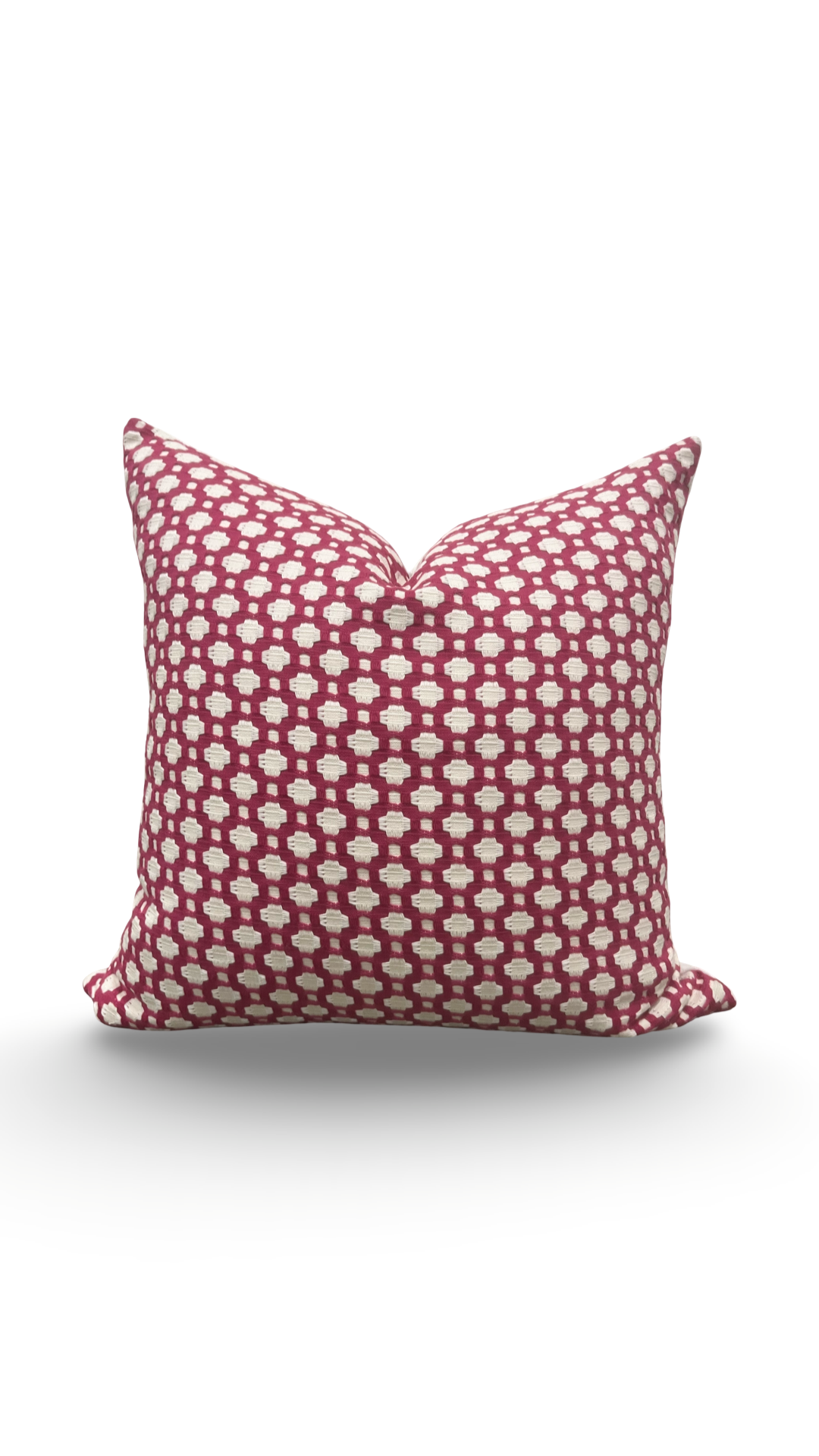 Decorative pillow with a red and white pattern on a white background