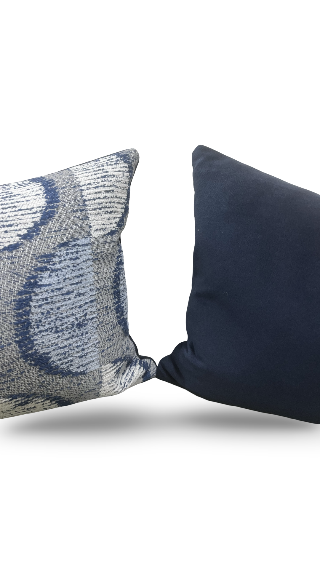 Two decorative pillows, one with a textured pattern and the other solid black, on a white background.