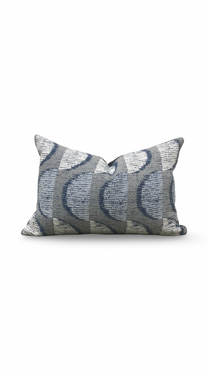 Decorative pillow with a wavy pattern on a white background
