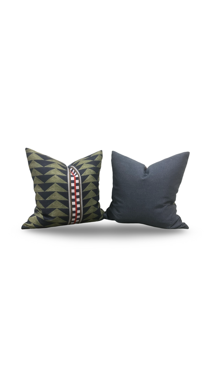 Two decorative pillows, one with a geometric pattern and the other solid color, on a white background.