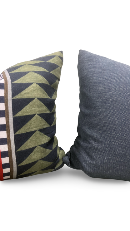 Two pillows, one with geometric pattern and the other solid color, on a white background