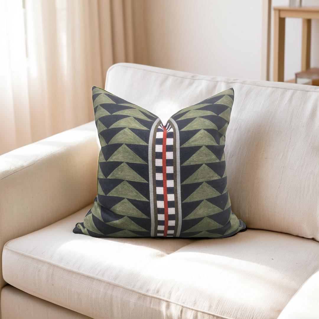 Decorative pillow with geometric pattern on a beige sofa
