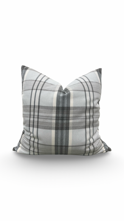 Plaid pillow with gray and white pattern on a white background