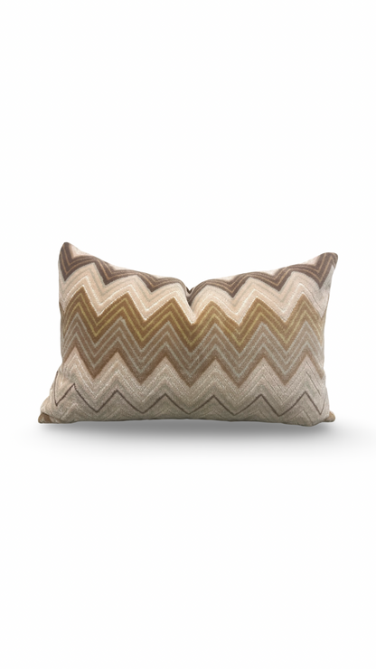 Decorative pillow with zigzag pattern on a white background