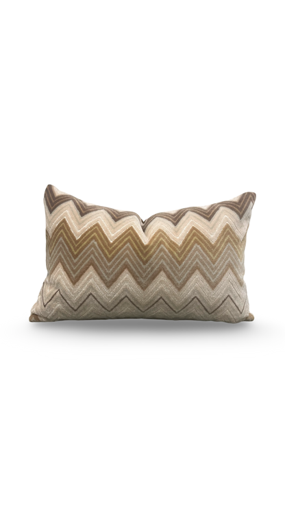 Decorative pillow with zigzag pattern on a white background