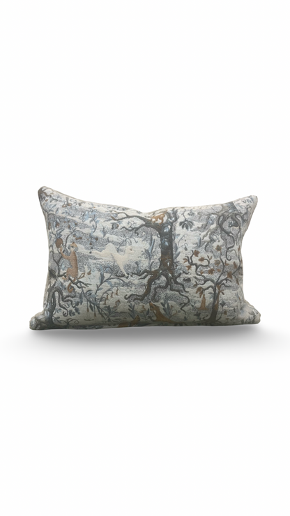 Decorative pillow with nature-themed pattern on a white background