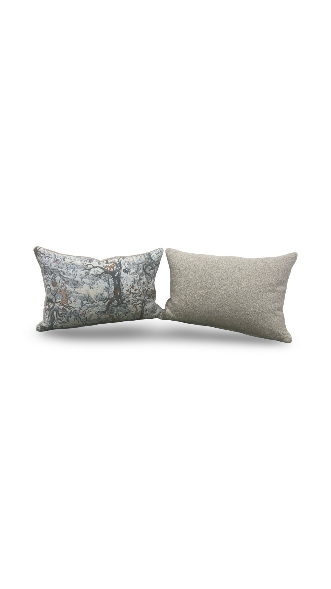 Two pillows, one with a textured pattern and one solid color, on a white background
