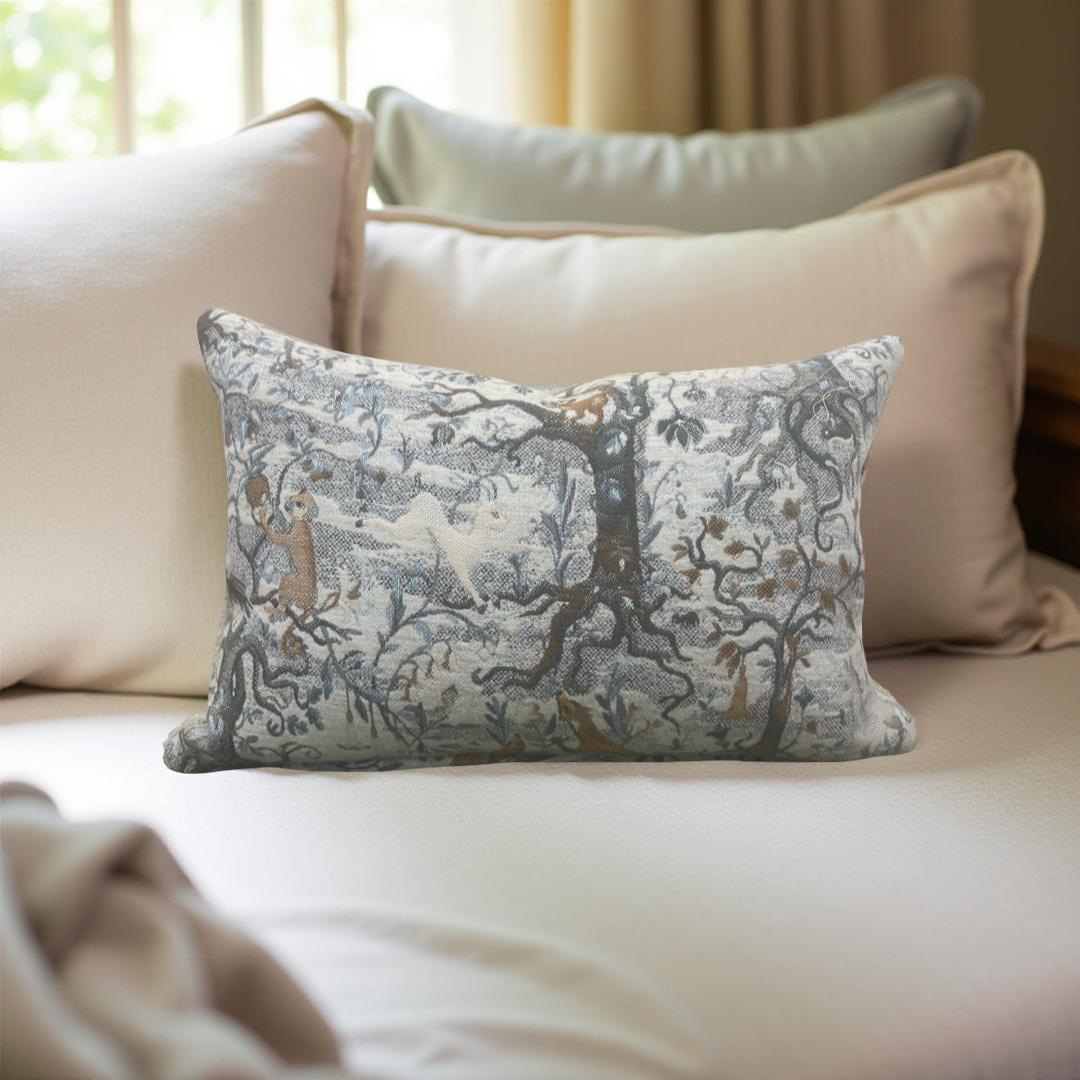 Decorative pillow with nature-themed design on a beige sofa