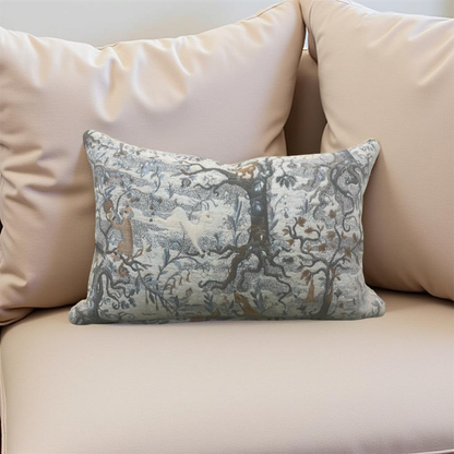 Decorative pillow with tree design on a beige sofa
