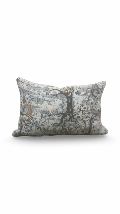 Decorative pillow with nature-themed pattern on a white background