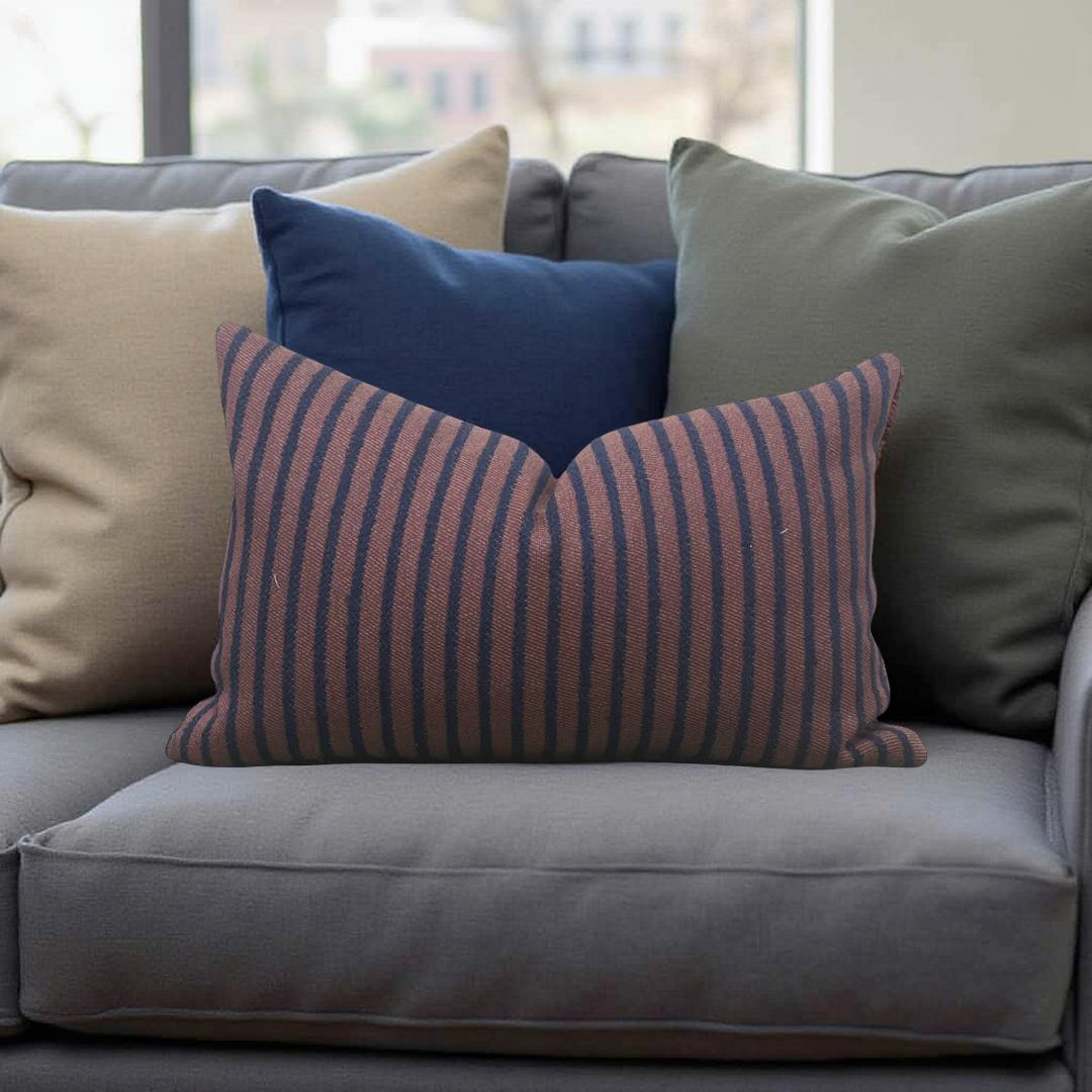 Gray sofa with colorful pillows including a striped brown and blue pillow.