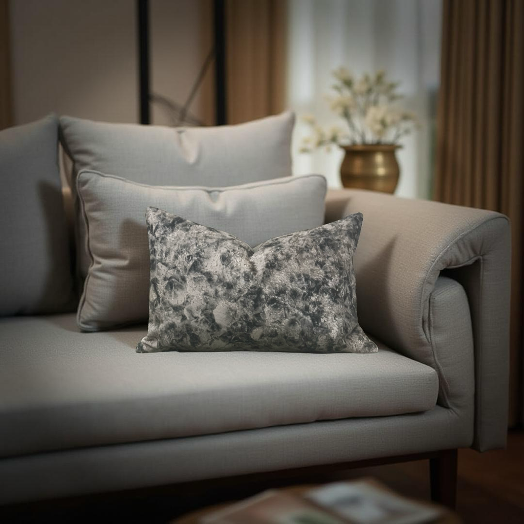 Gray sofa with decorative pillows in a living room setting