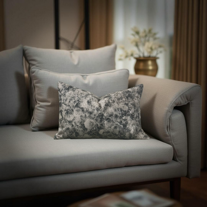 Gray sofa with decorative pillows in a living room setting