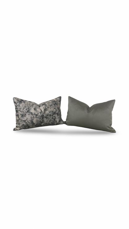 Two gray pillows on a white background