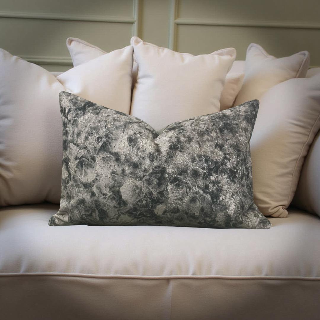 Decorative pillow on a sofa with other pillows in the background