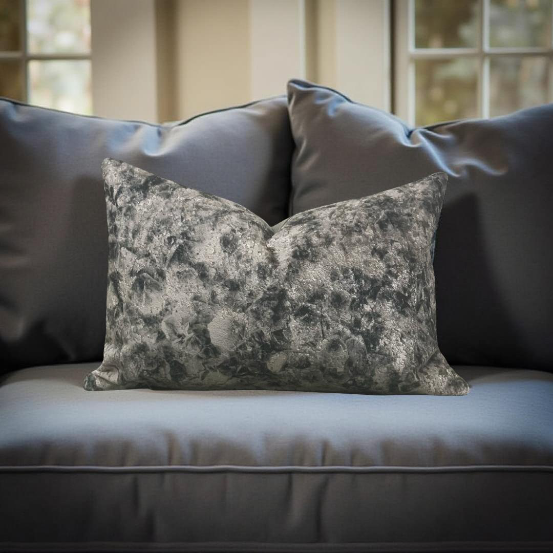 Decorative pillow with floral pattern on a gray sofa