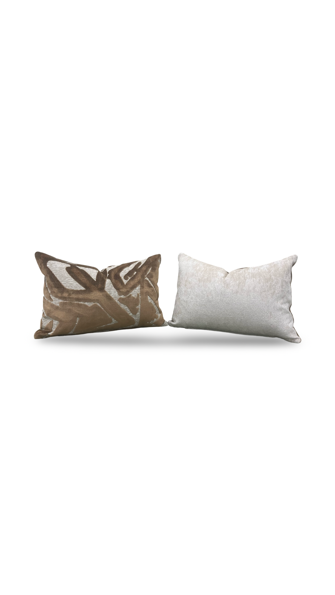 Two decorative pillows, one brown and one white, on a white background