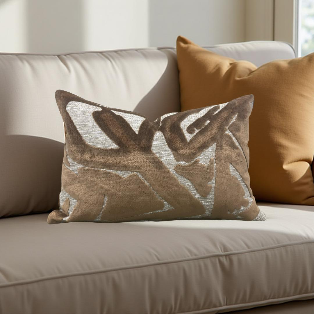 Decorative pillows on a beige sofa in a home setting