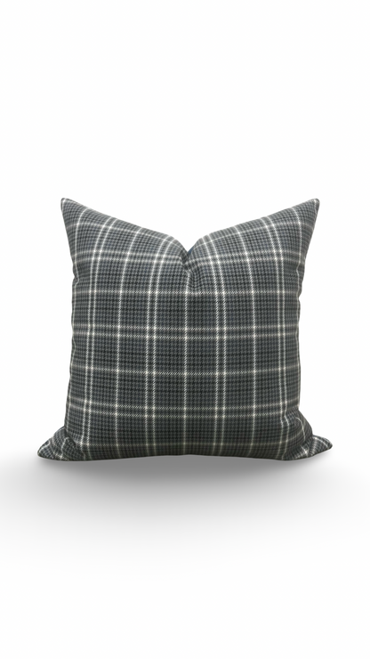 Plaid patterned pillow on a white background