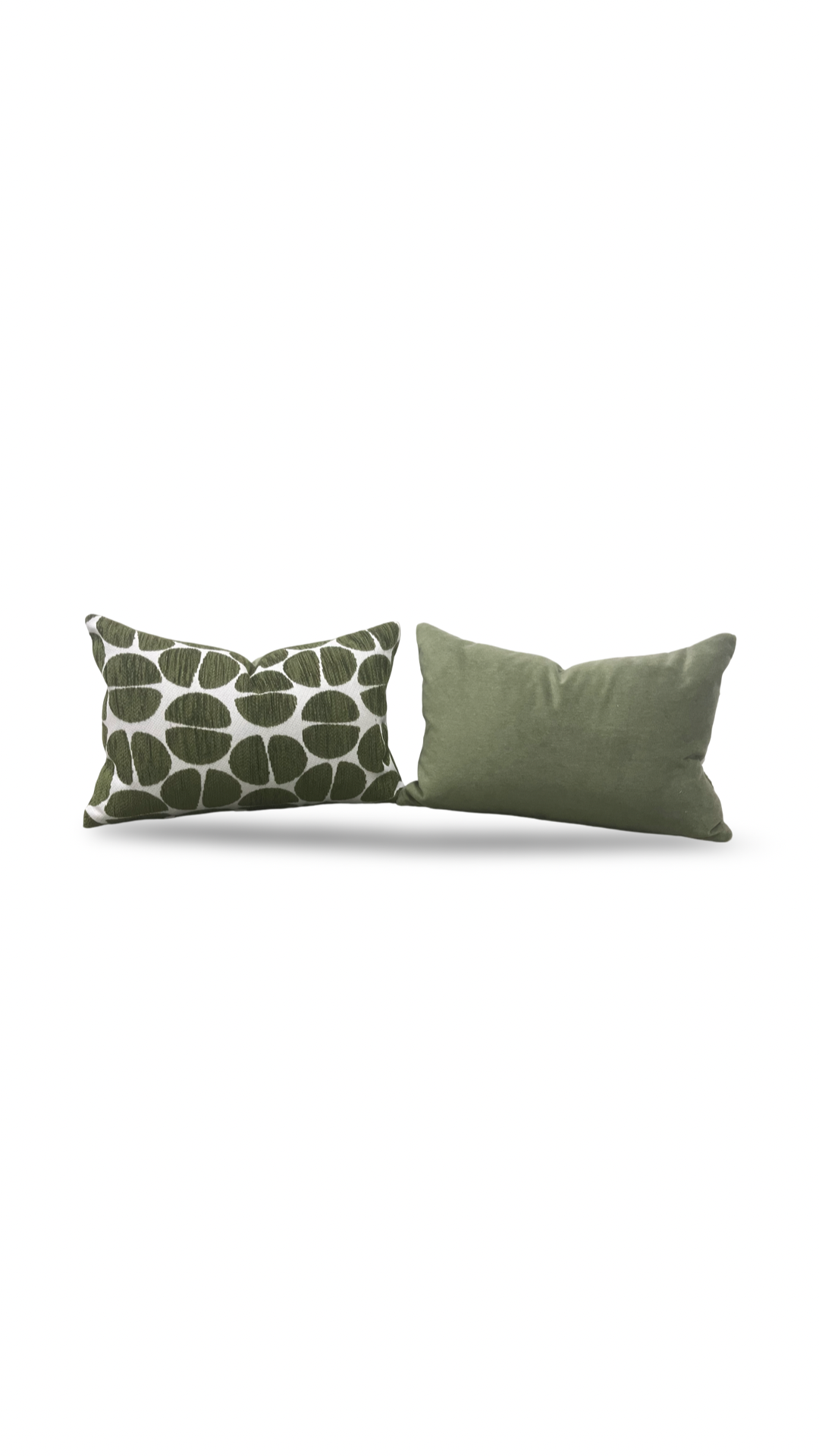 Two green pillows, one with a leaf pattern, on a white background