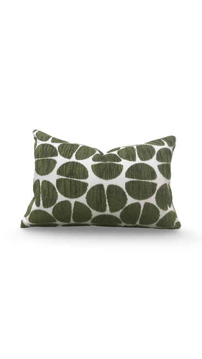 Green patterned pillow on a white background