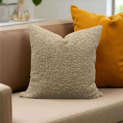 Tan pillow on sofa