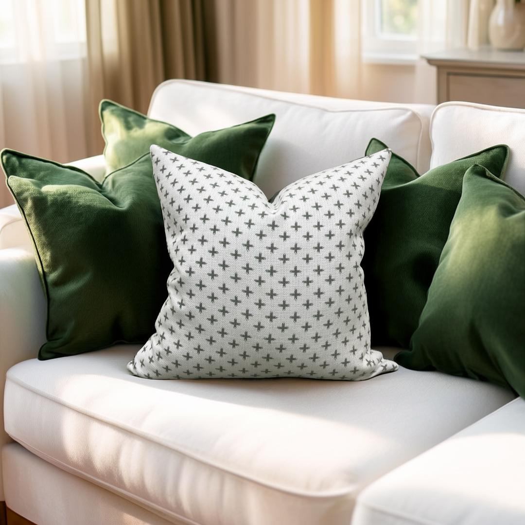 White sofa with green and patterned cushions in a living room setting