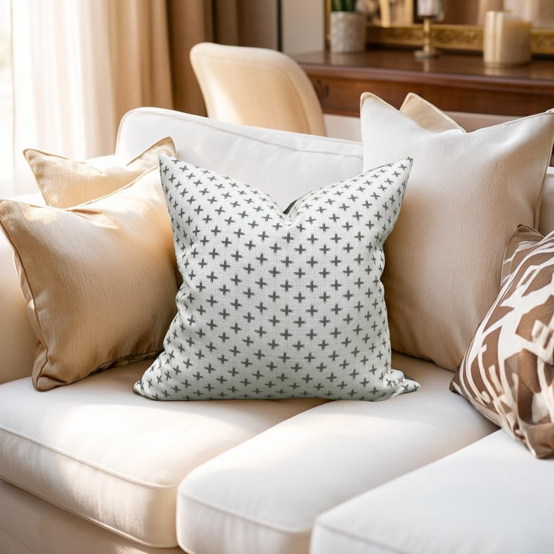 Decorative pillows on a white sofa with a neutral color scheme.