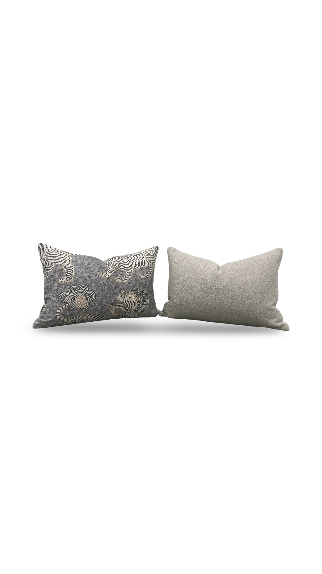 Two gray pillows with decorative patterns on a white background