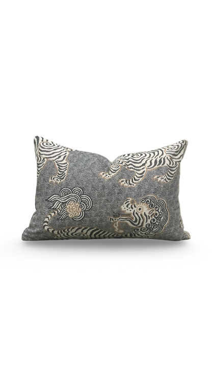 Decorative pillow with embroidered tiger design on a gray background
