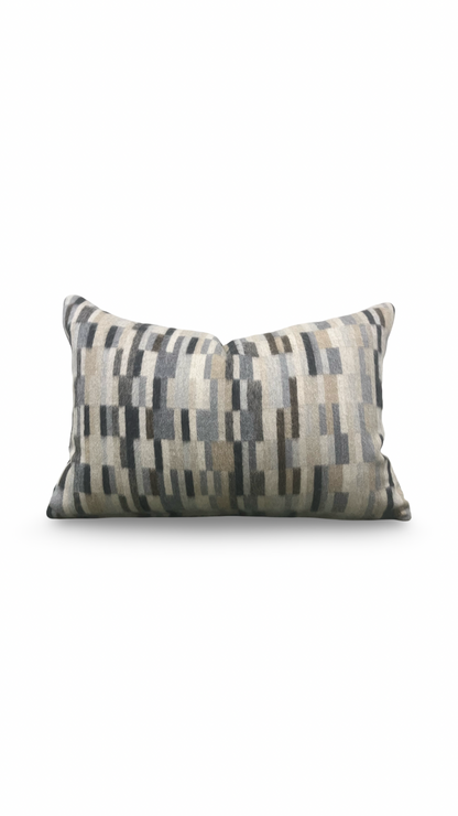 Decorative pillow with geometric pattern on a white background