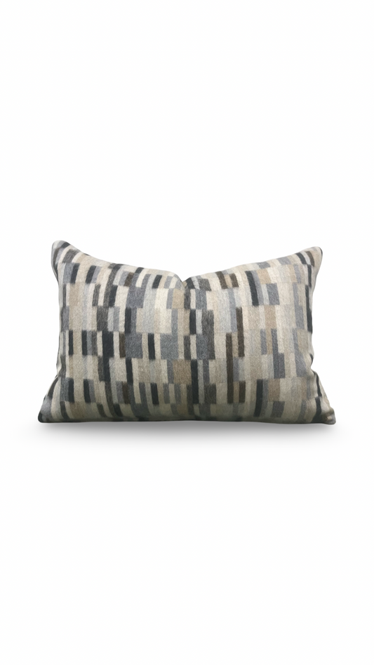 Decorative pillow with geometric pattern on a white background