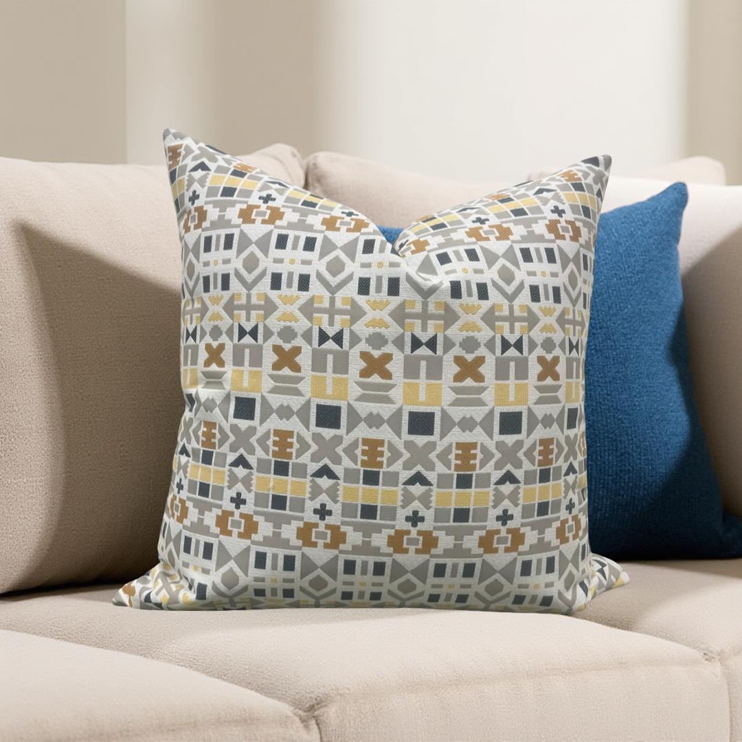 Decorative pillow with geometric pattern on a beige sofa