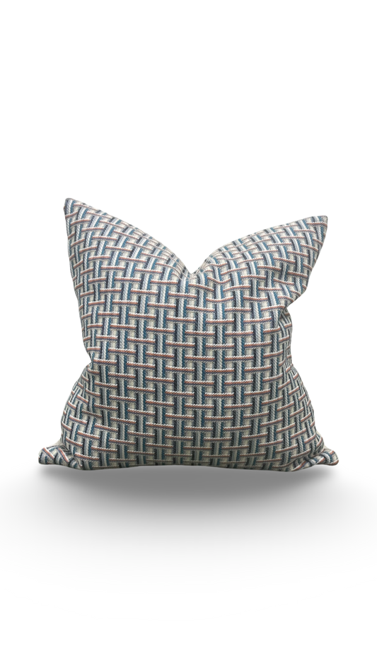 Decorative pillow with geometric pattern on a white background