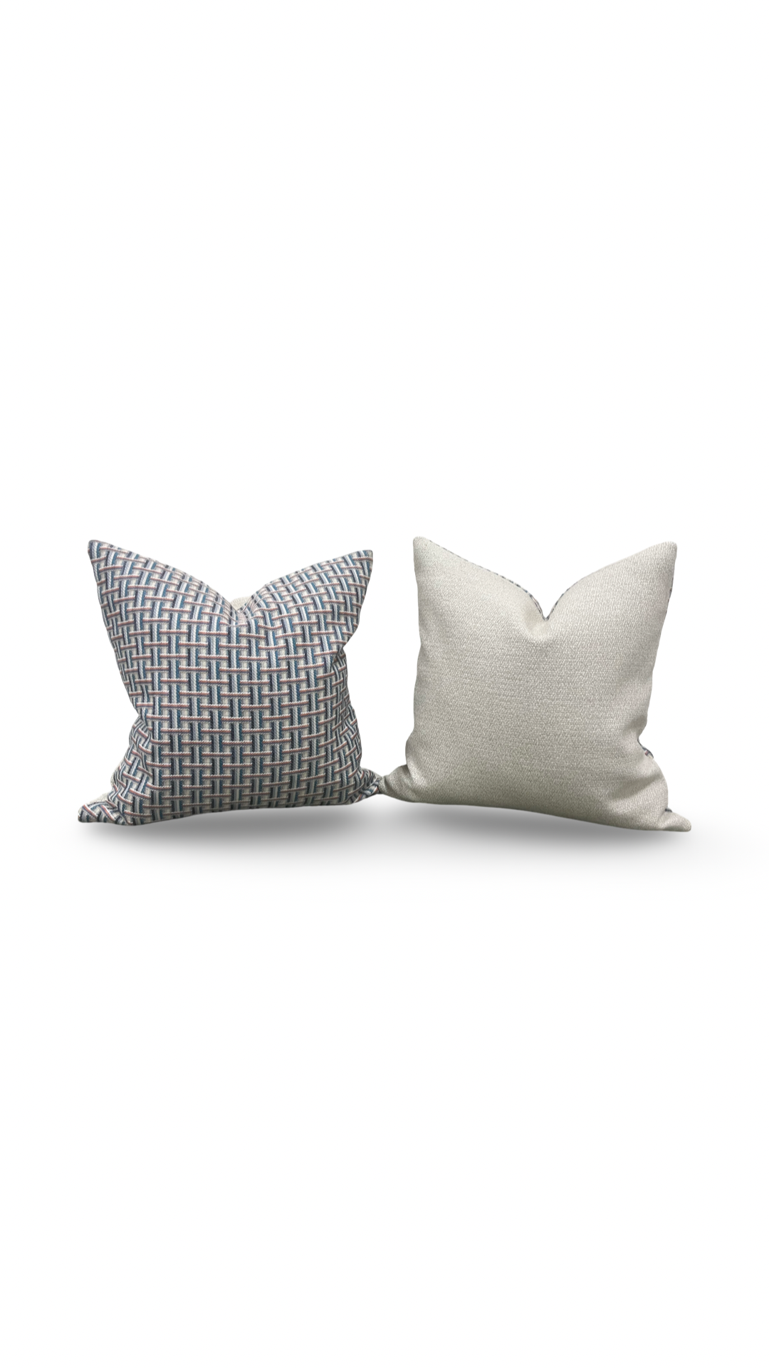 Two decorative pillows, one gray and one white, on a white background