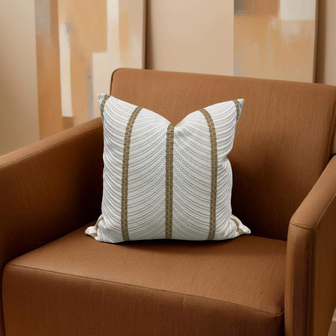 Decorative pillow with striped pattern on a brown chair