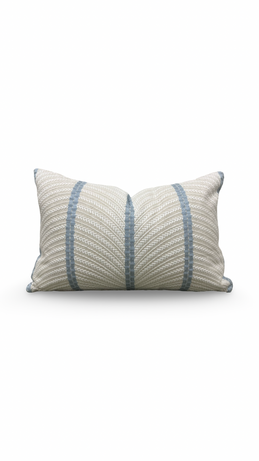 Decorative pillow with blue stripes on a white background