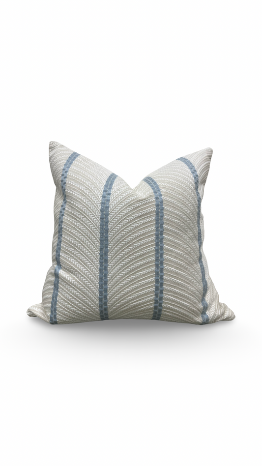 Striped pillow with blue and gray pattern on a white background