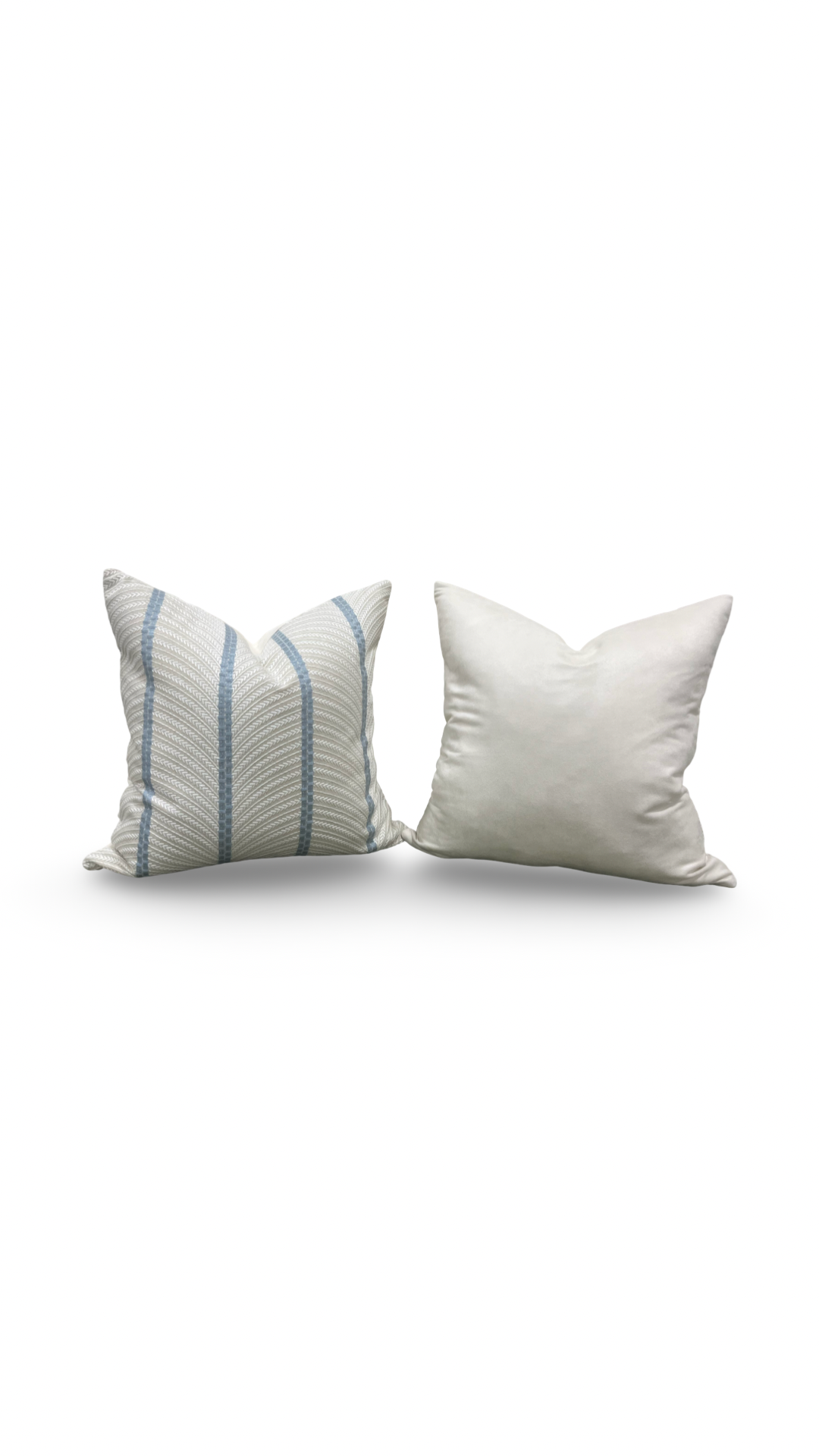 Two pillows, one with blue stripes and one plain white, on a white background