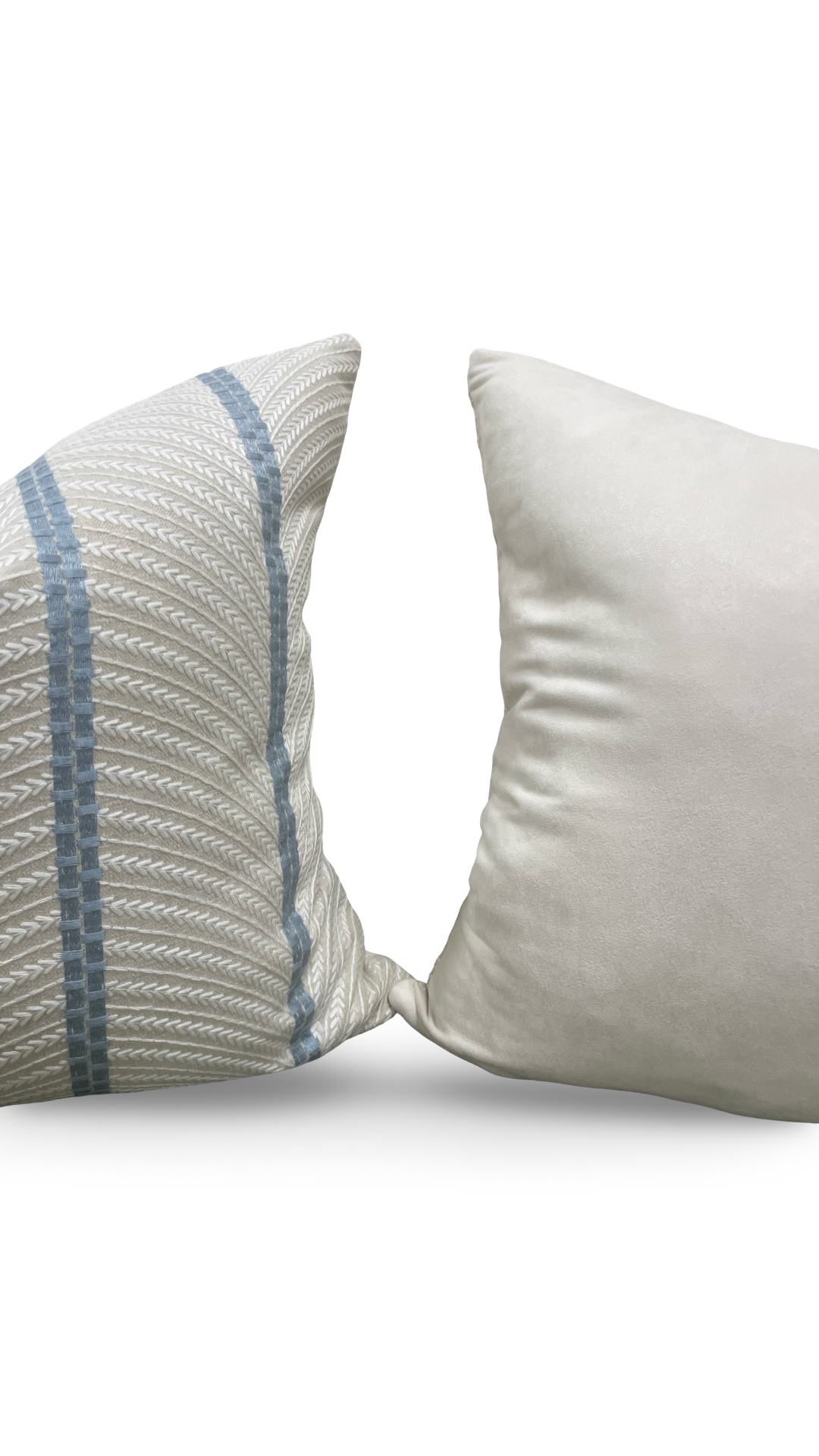 Two pillows, one with a textured pattern and the other plain, on a white background