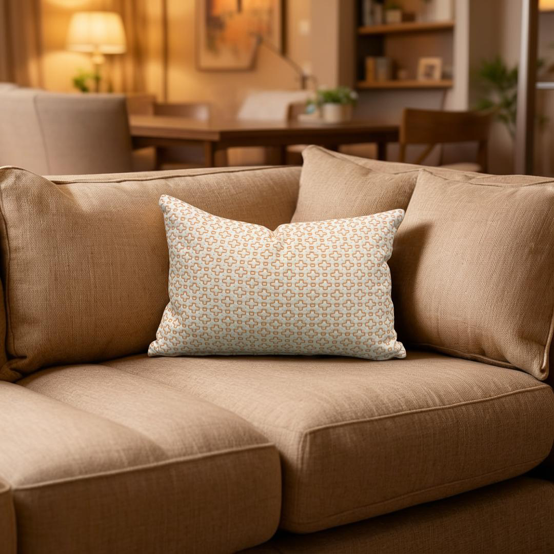 Patterned pillow on a beige sofa in a living room setting