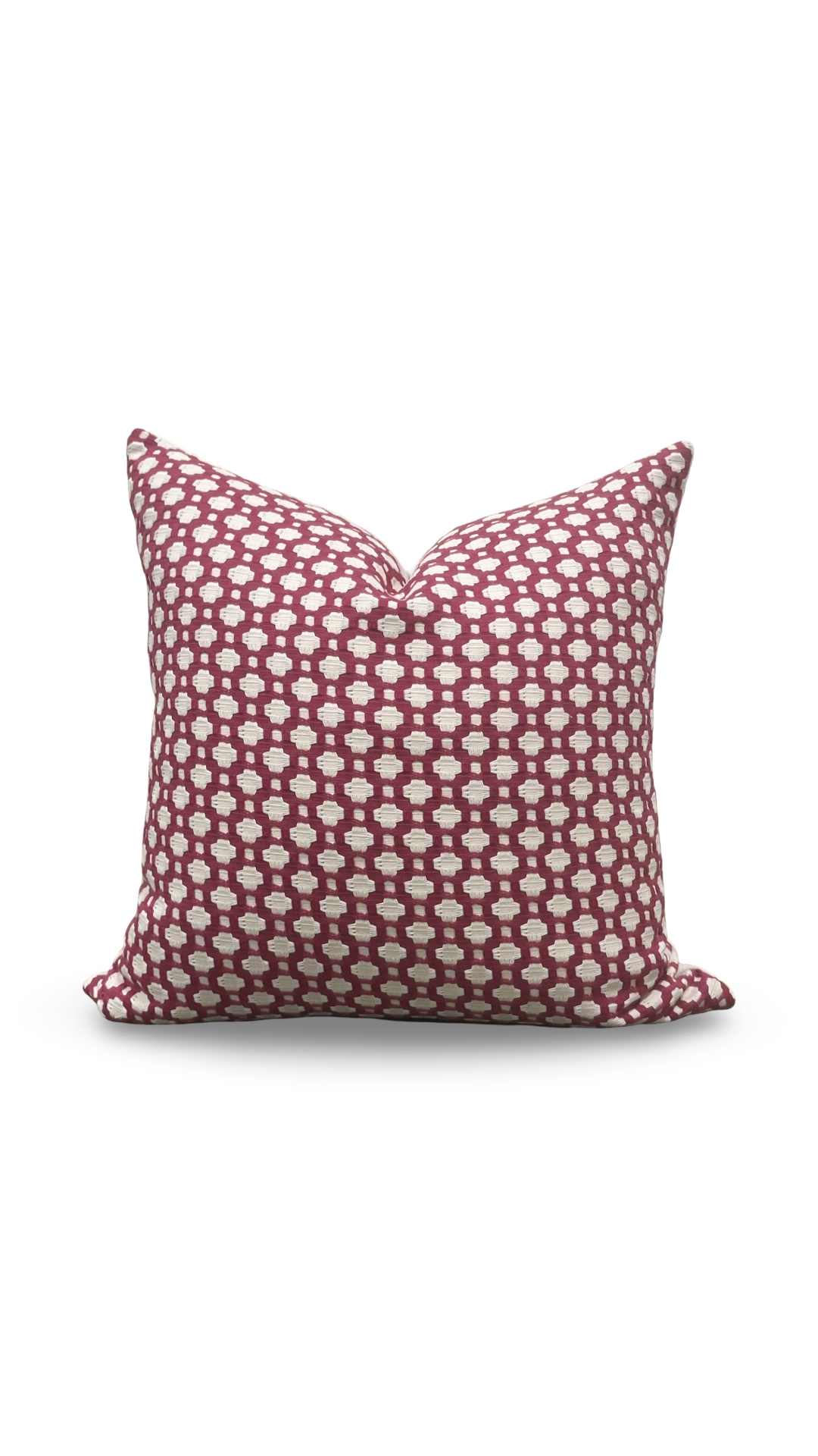 Decorative pillow with red and white pattern on a white background
