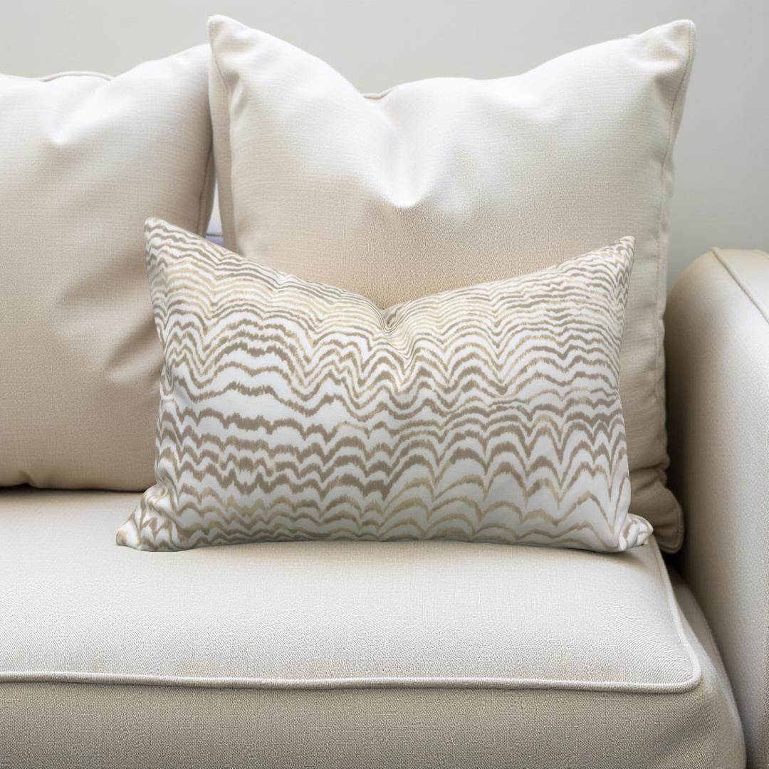 Beige pillow with a wavy pattern on a beige sofa