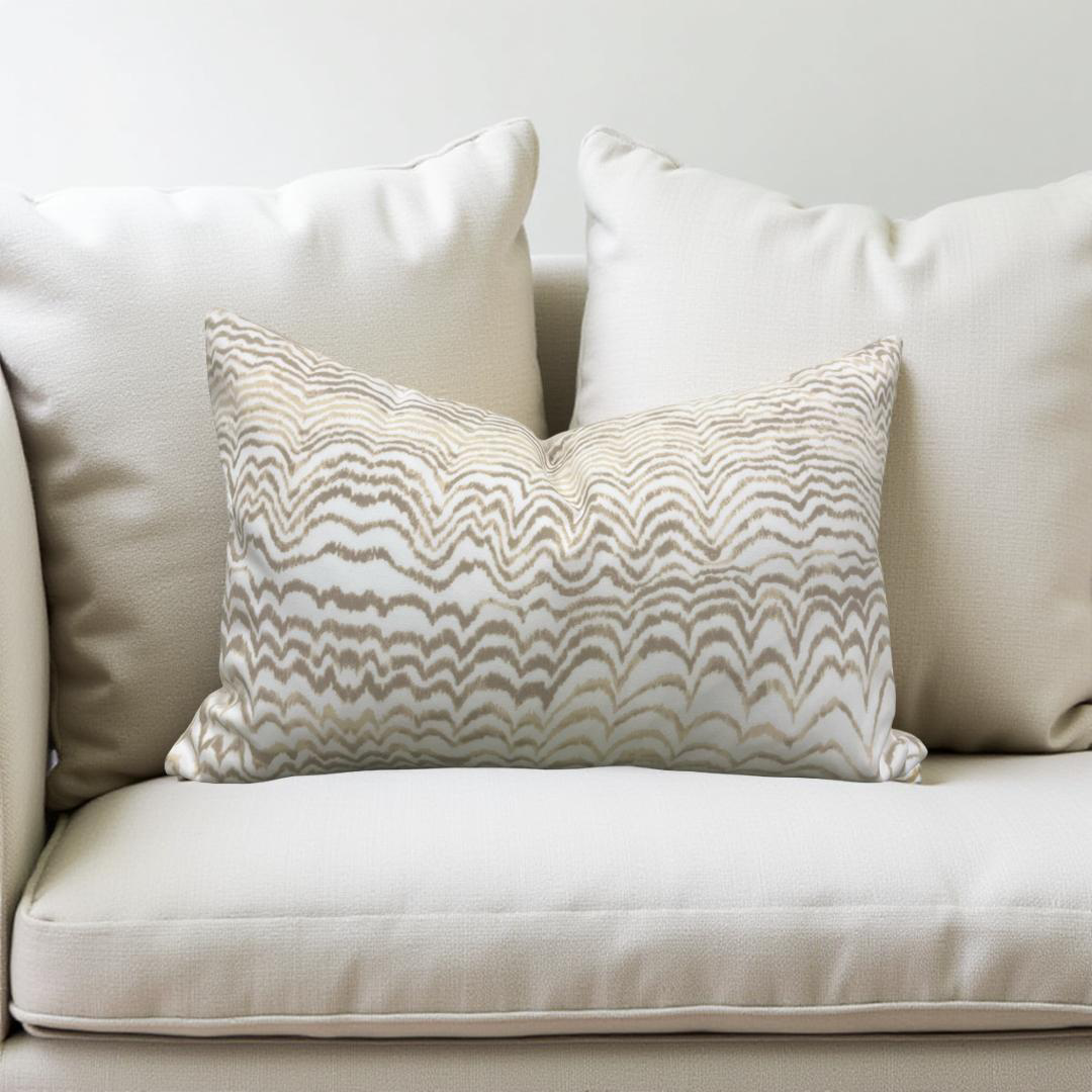 Decorative pillow with wavy pattern on a beige sofa