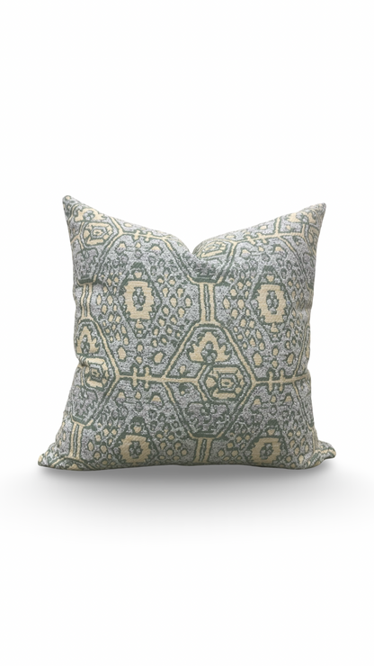 Decorative pillow with geometric pattern on a white background
