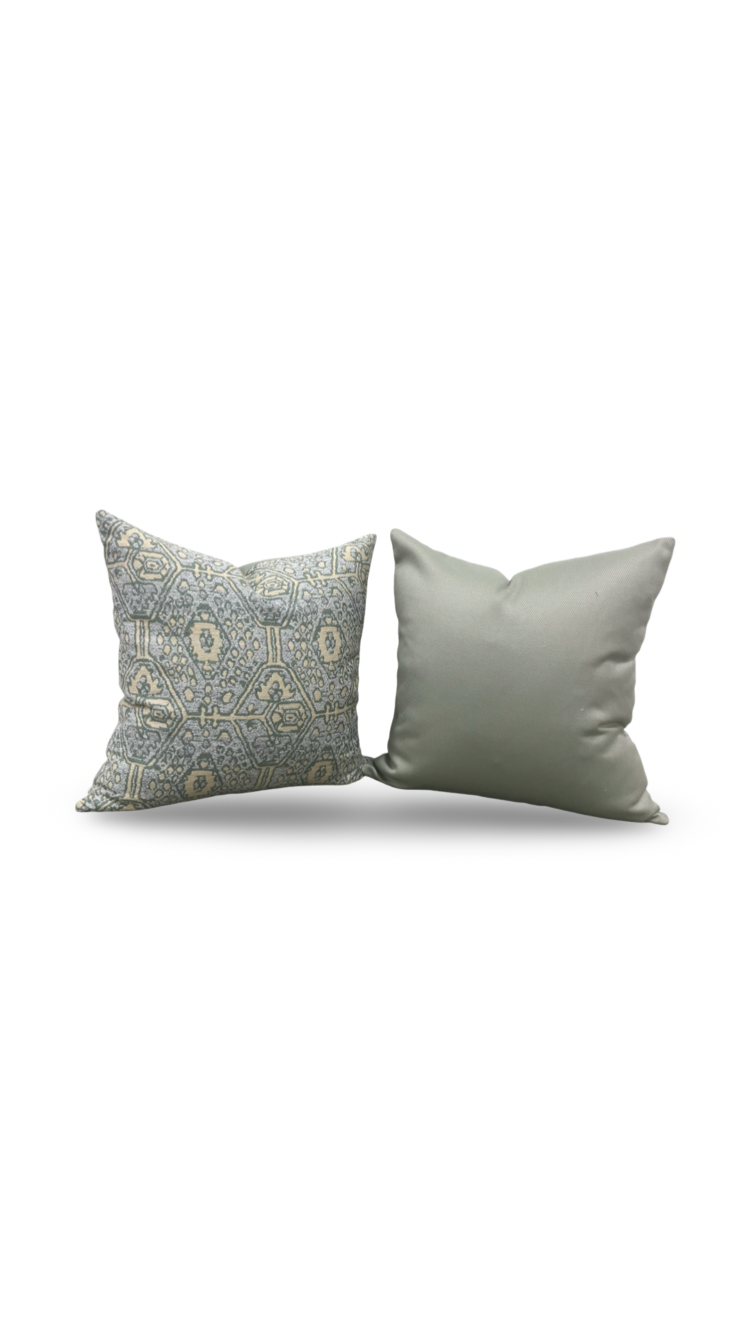 Two decorative pillows, one with a patterned design and the other plain, on a white background.