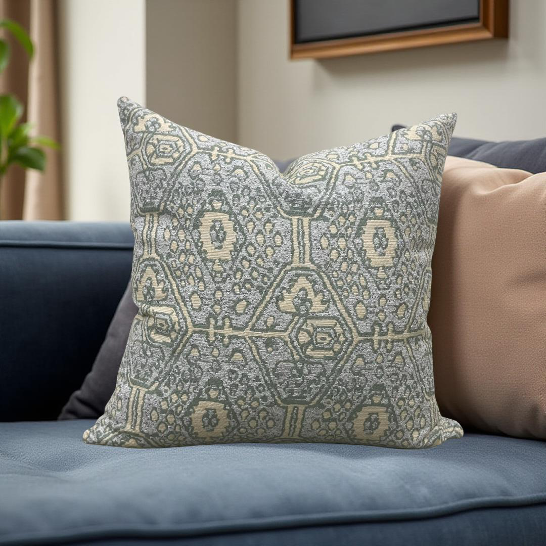 Decorative pillow with geometric pattern on a blue sofa