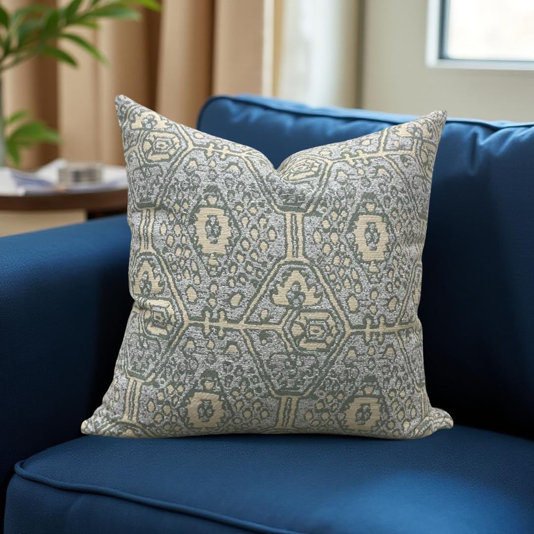 Decorative pillow with geometric pattern on a blue couch