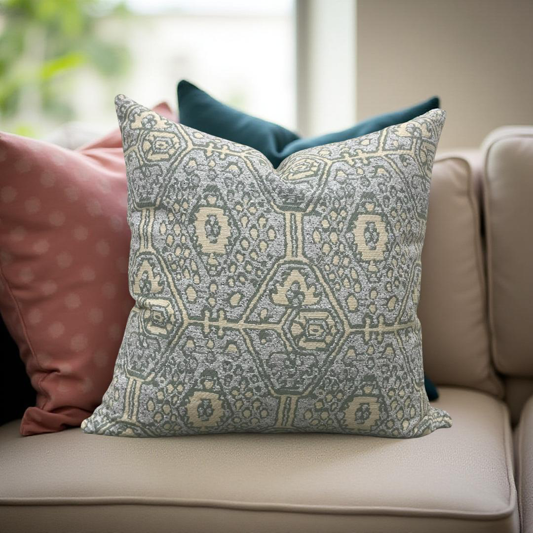 Decorative pillow with geometric pattern on a beige sofa